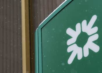 Snow sits on top of a logo displayed outside a Citizens Financial Group Inc. bank branch in downtown Portsmouth, Ohio. Photographer: Ty Wright/Bloomberg